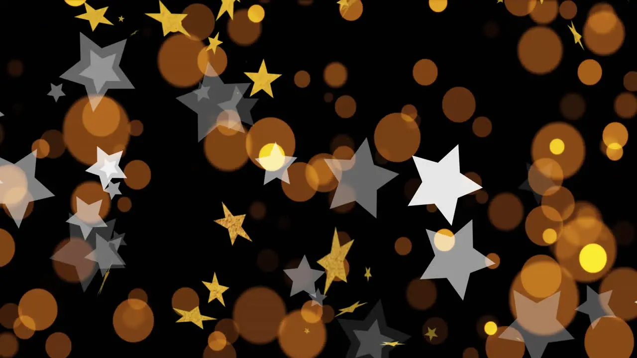 Animation of gold and white stars yellow and orange light spots on black background