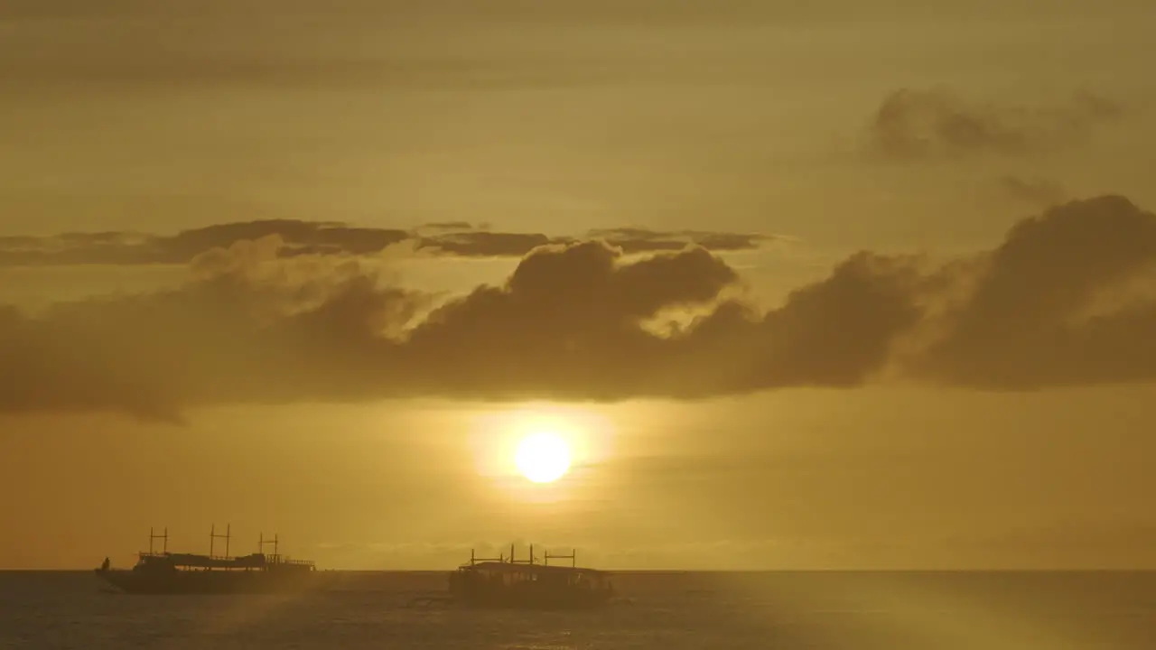 Static Shot Of Passenger Boats In Silhouette Sailing In Boracay While Sunset