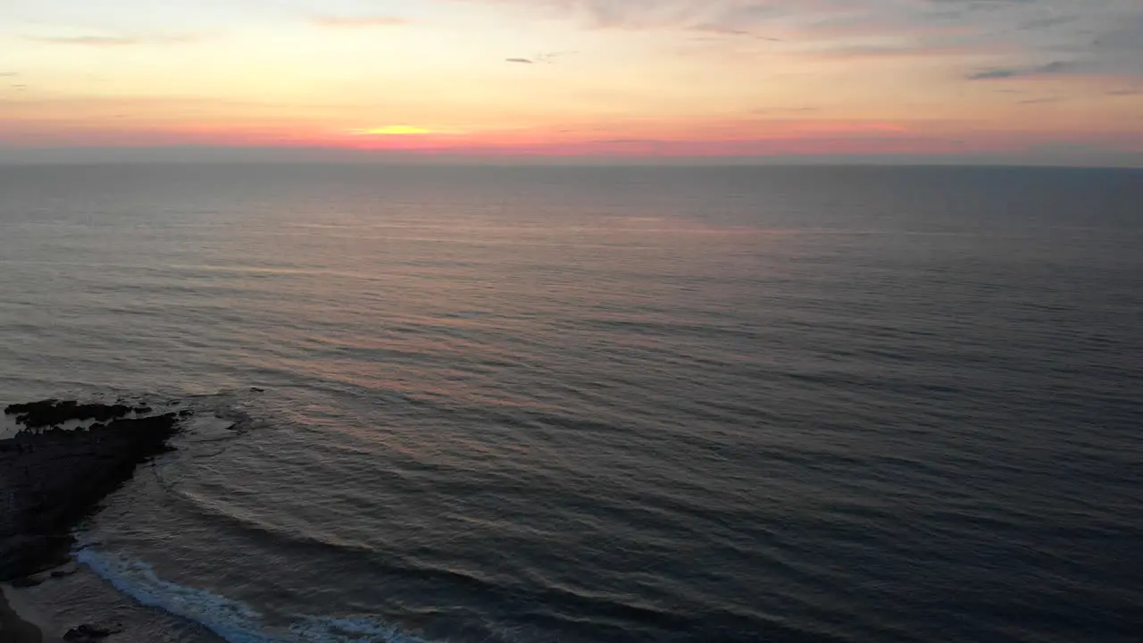 Aerial approaching sunset over sea in La Union Philippines