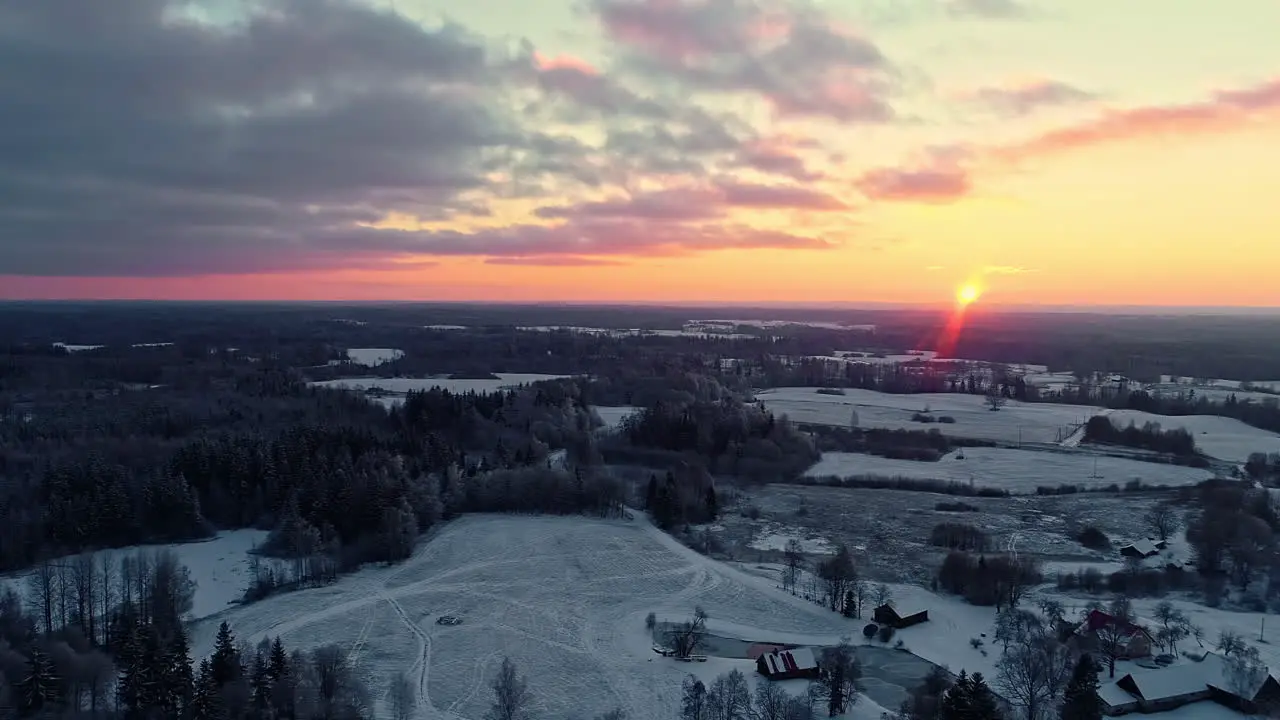 Beautiful drone shot of snow covered nature landscape at sunset