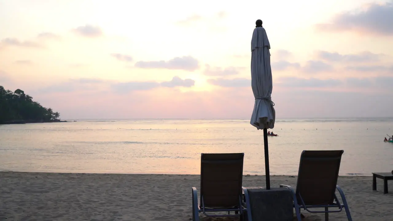 Beautiful Silhouette luxury umbrella and chair on beach