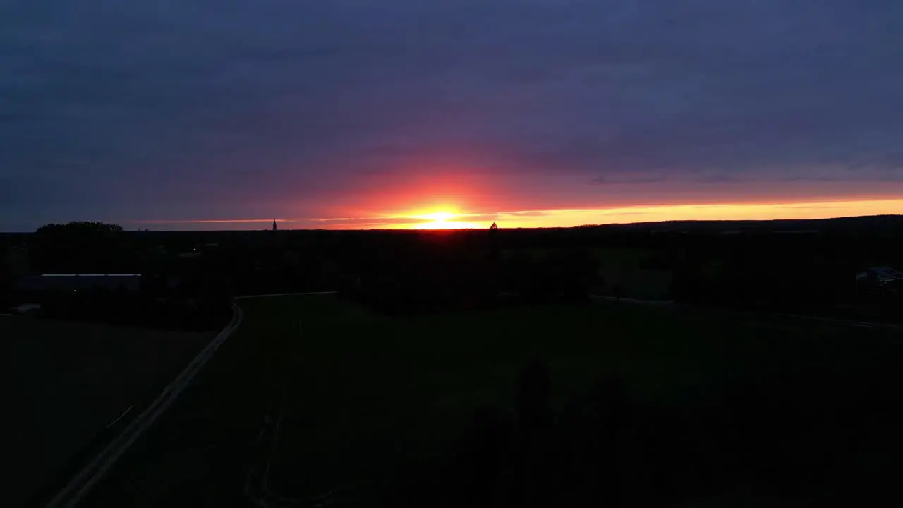 Dramatic Golden Orange Sunset Sky With Silhouette Landscape View