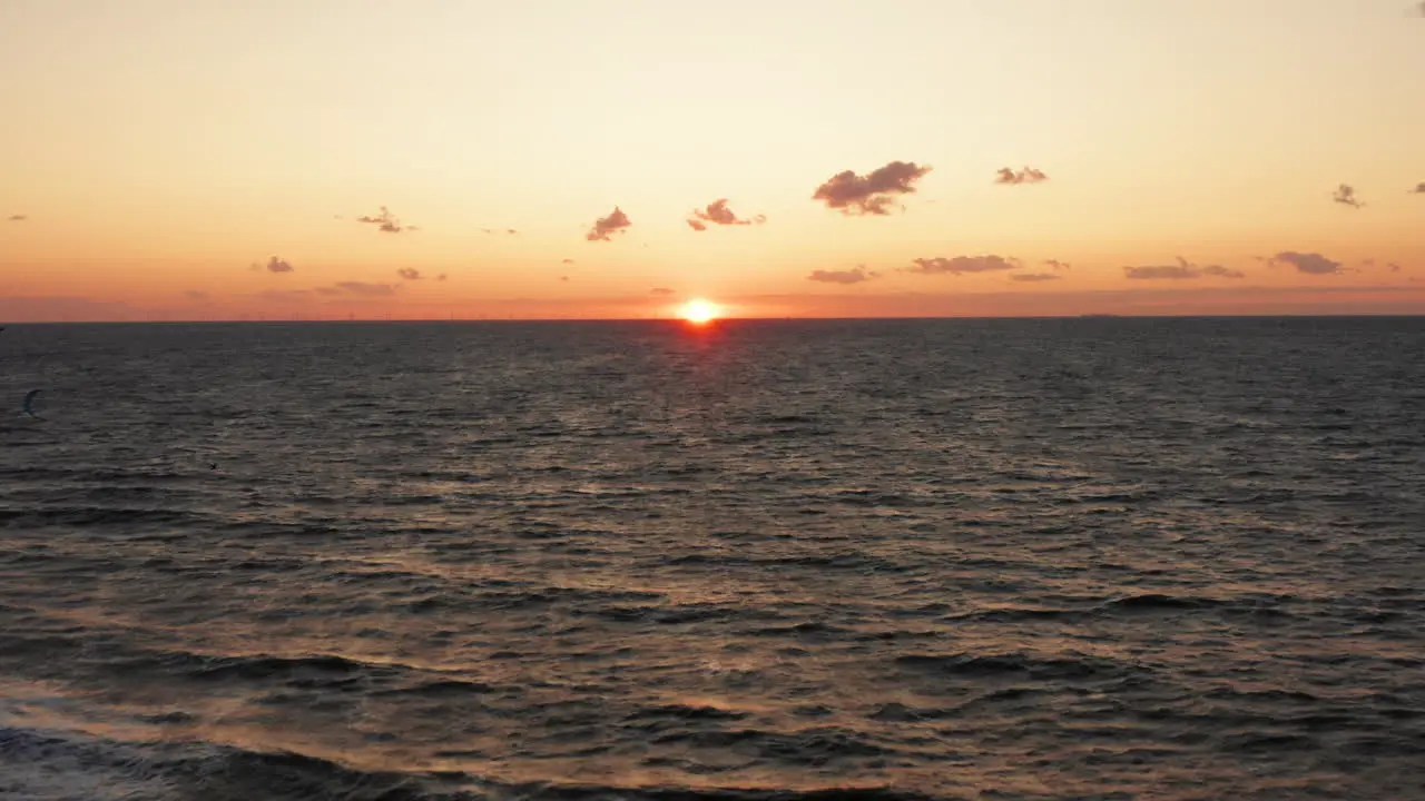 Kitesurfers near the beach of Domburg during sunset