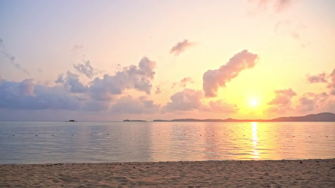 Panoramic View of a Tropical Sunset Above Empty Island Beach Peninsula and Calm Sea With Stunning Cloudy Horizon