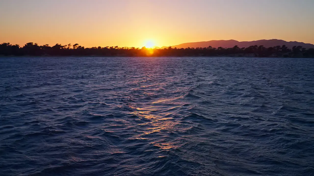 Slow motion waves at sunset handheld