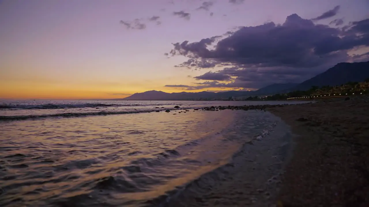 Ocean waves at the beach after sundown