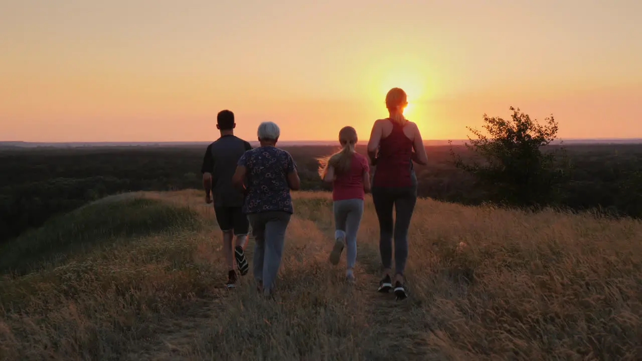 Several Generations Of A Family Running Together In A Beautiful Location