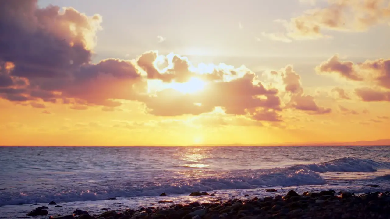 Relaxing sundown at a rocky beach