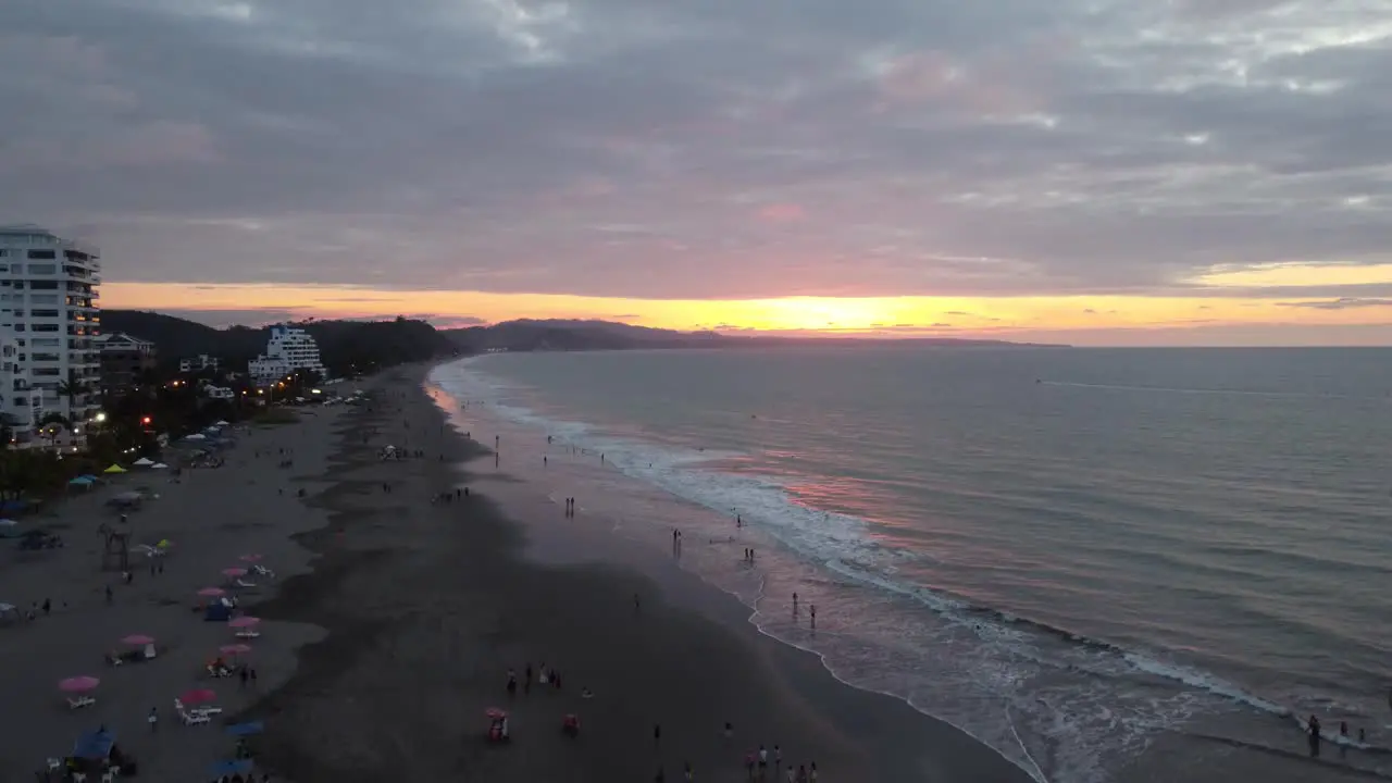 Drone shot of people enjoying the sunset at Same beach Casa Blanca Ecuador