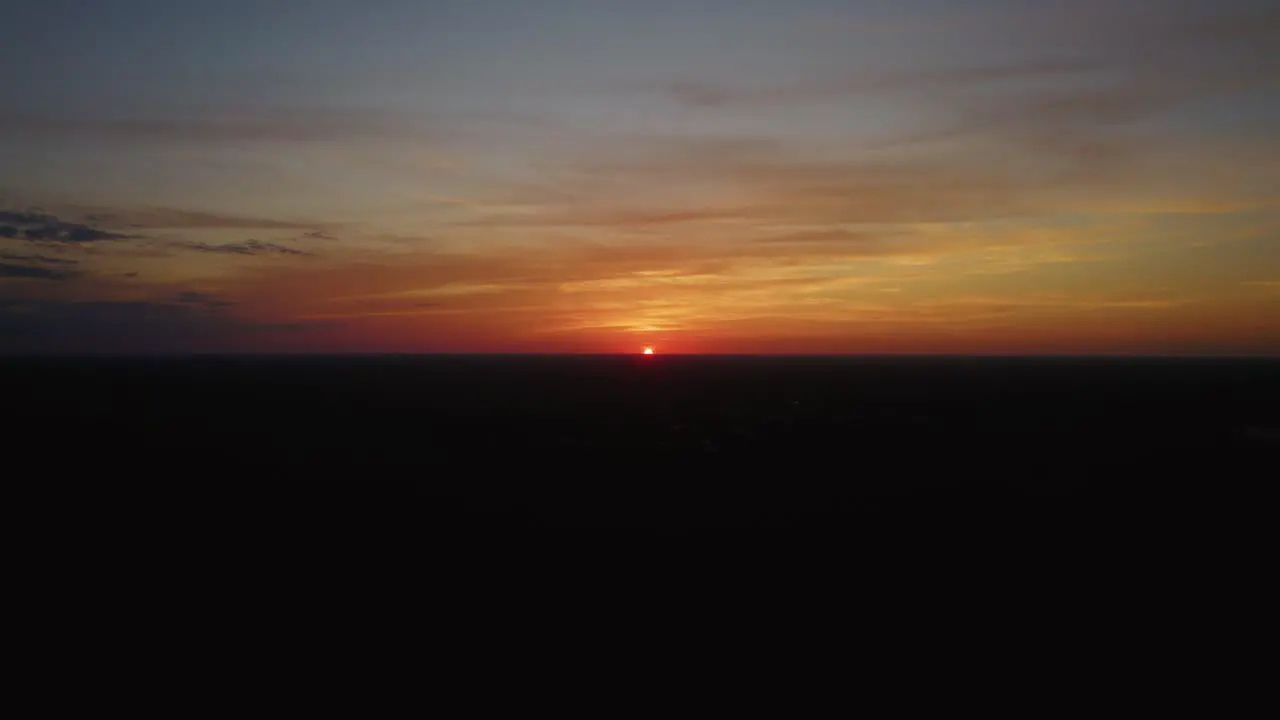 Aerial view of the sun setting over Mexico's tropical beaches