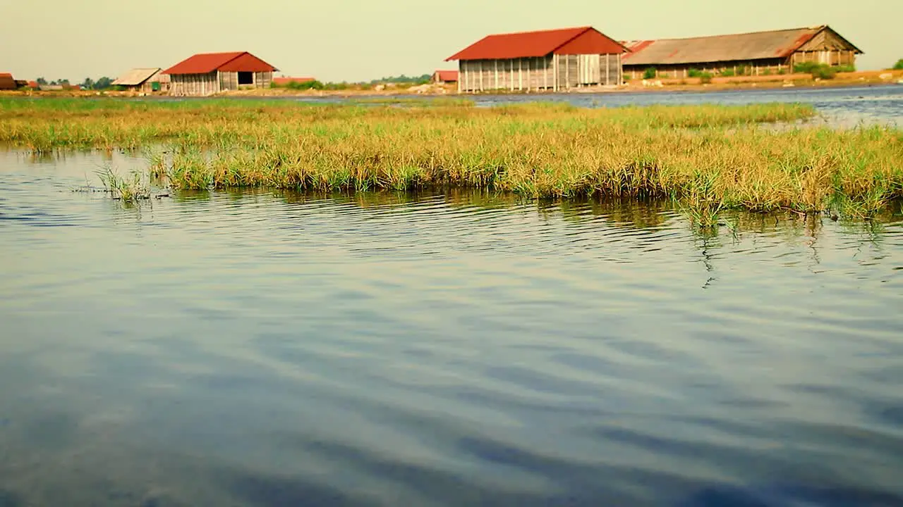 Flooded salt farm and salt storage house in Kampot Cambodia during the monsoon season