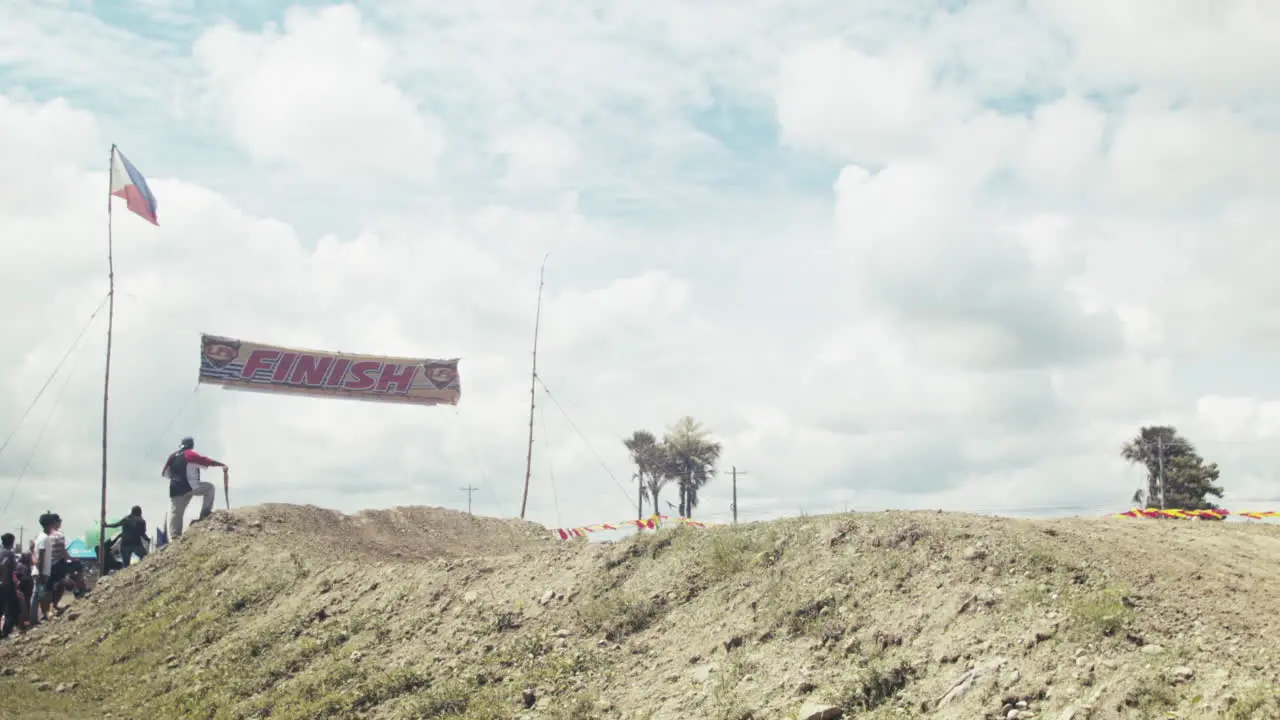 Participants fly through the finish line of the highly anticipated motocross competition