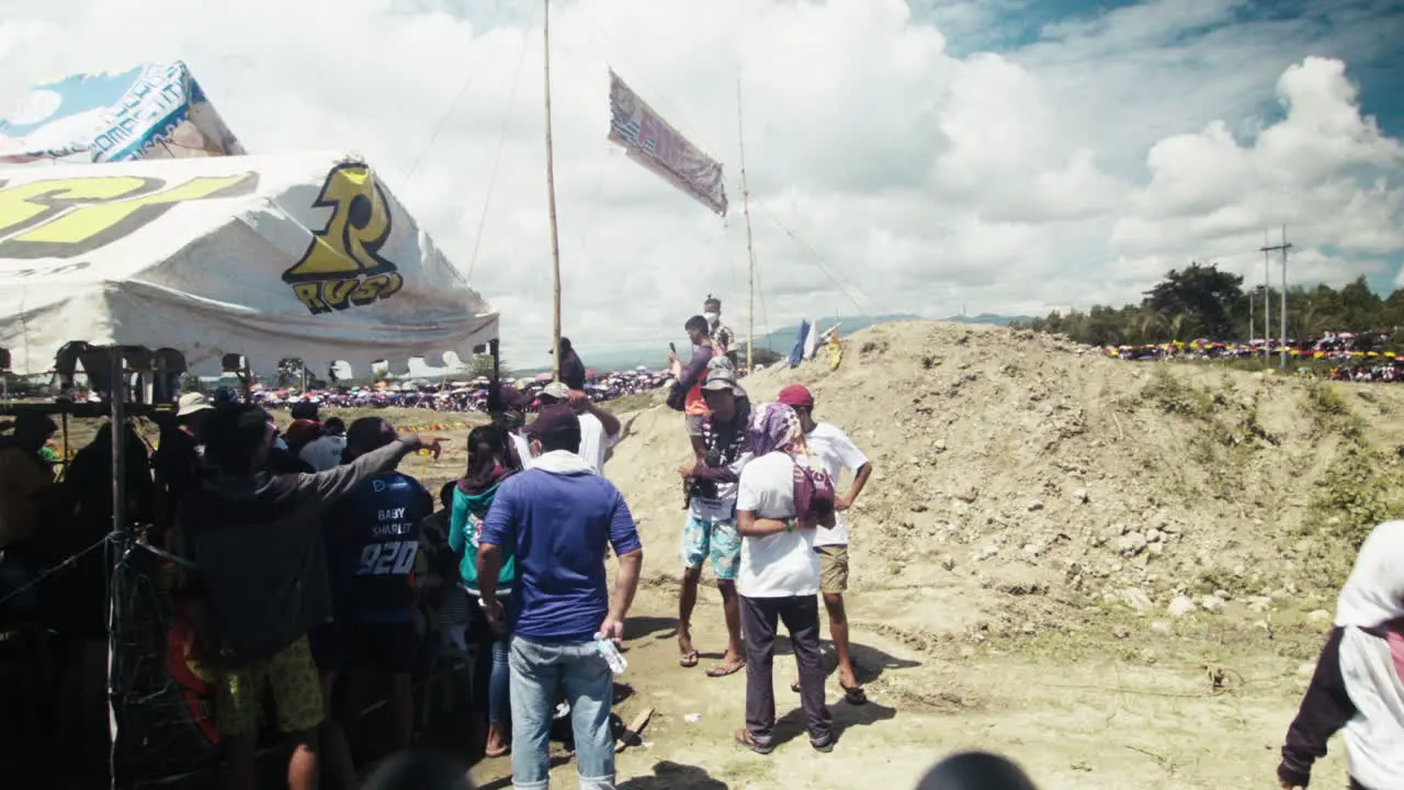 Crowds gathered nearby the race track as the motocross competition is about to start