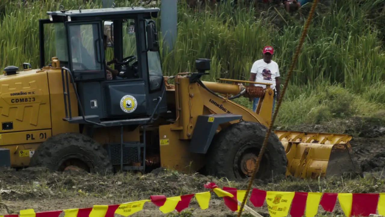 Race track is being prepared via bulldozer for day 2 of motocross competition