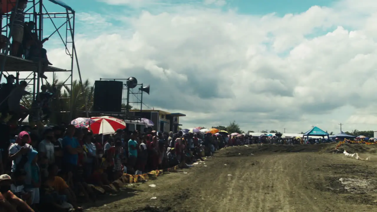 Bright sunny day as onlookers await the motocross competition to begin