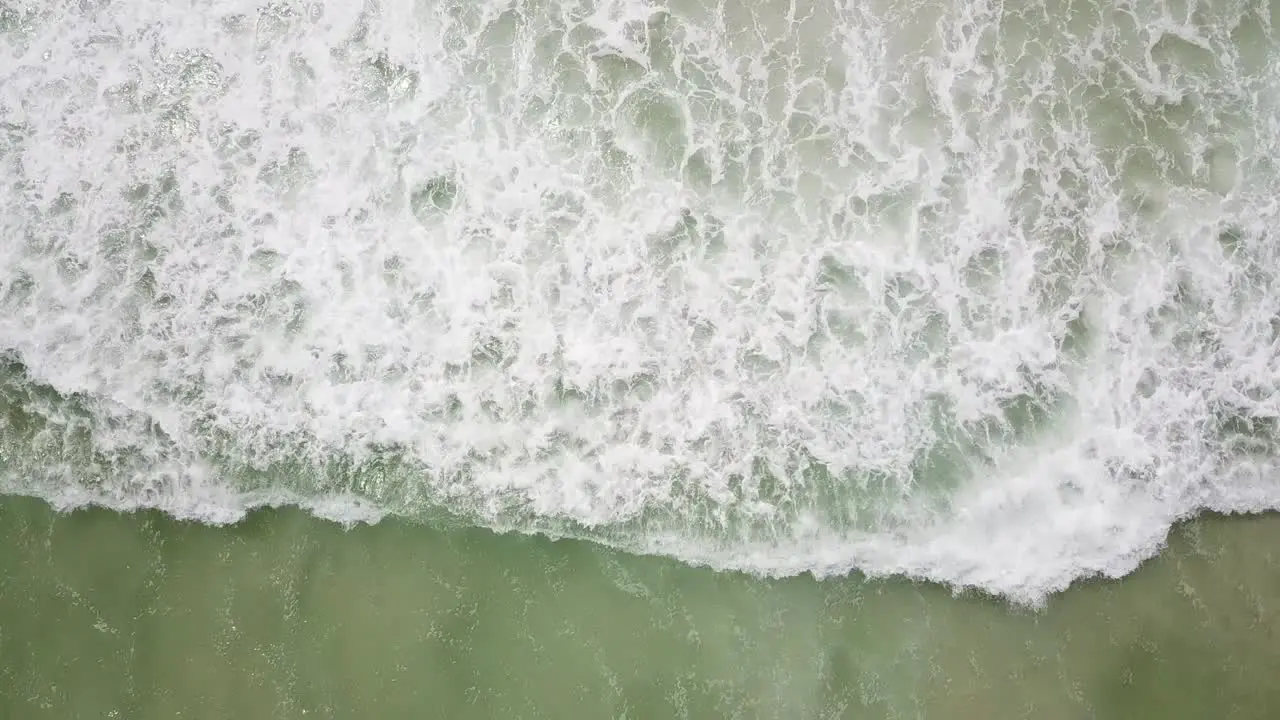 WAVES CRASHING ON THE SURF AS I DECEND