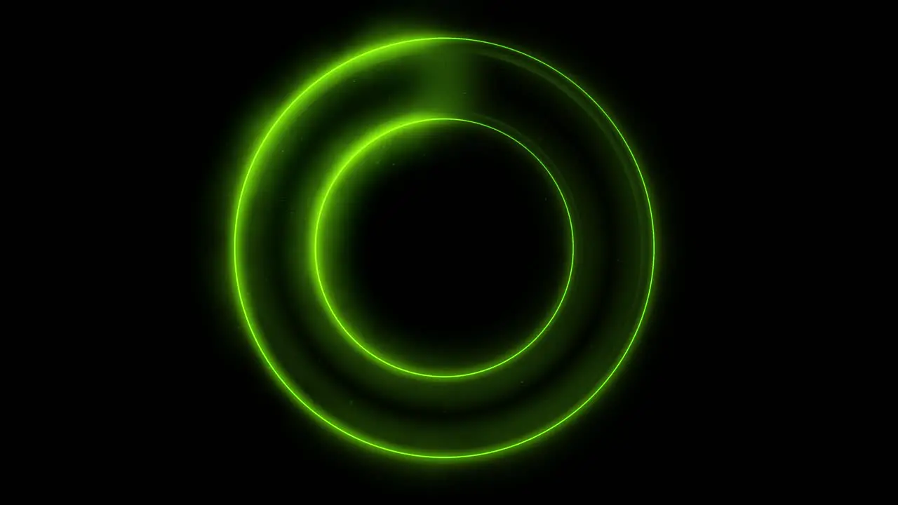 Seamless loop spinning flickering green neon ring on black background