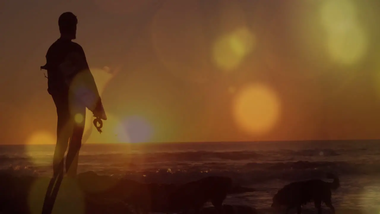 Animation of light spots over caucasian man at seaside