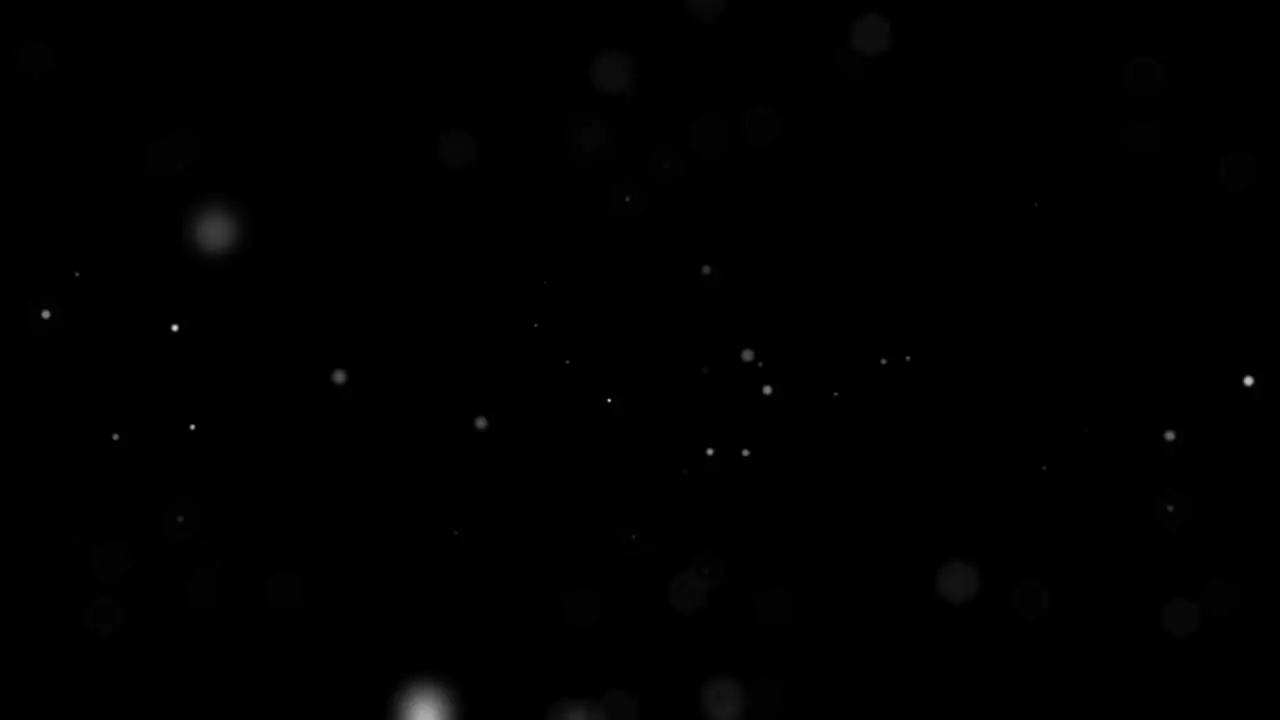 Snow-dust white particles moving slowly on black space