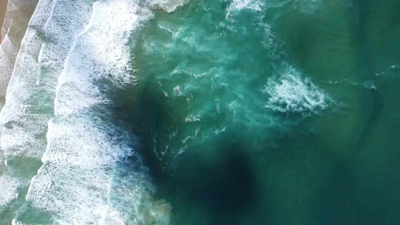 waves from above beautiful bordeira beach in algarve portugal