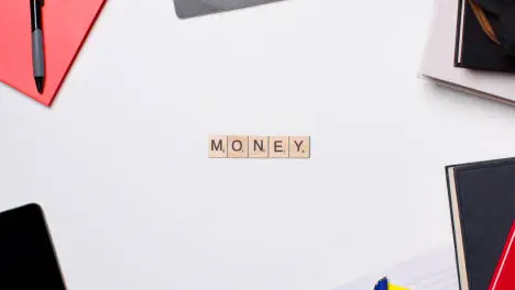 Stop Motion Business Concept Above Desk Wooden Letter Tiles Forming Word Money