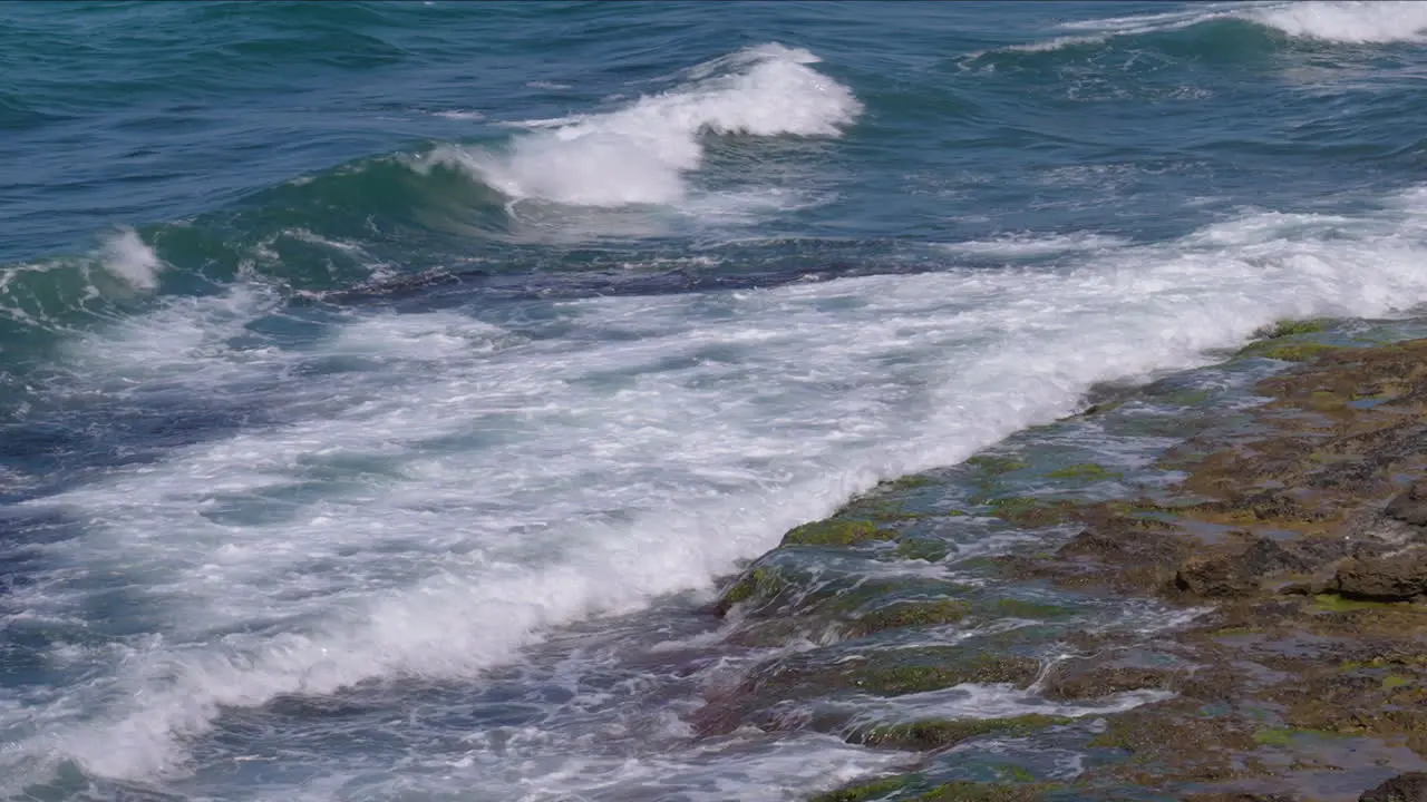 sea hurting the rocks in heraklion creta greece