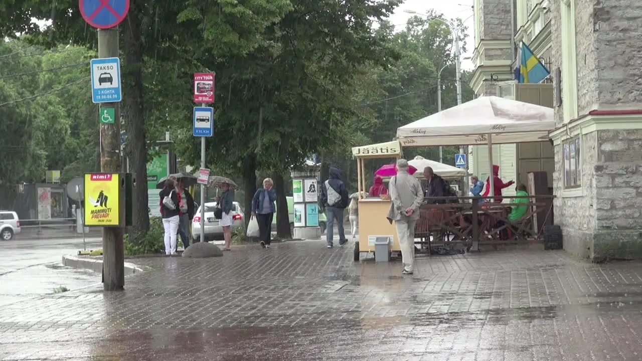 Tallinn Estonia people walk in the rain