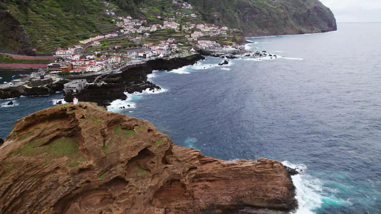 drone view Rocky cliffs Coast in Madeira Small town Portugal