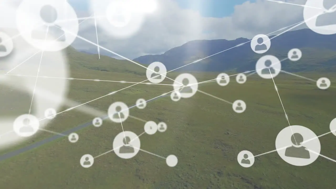 Animation of profile icons connected with lines over mountains against cloudy sky