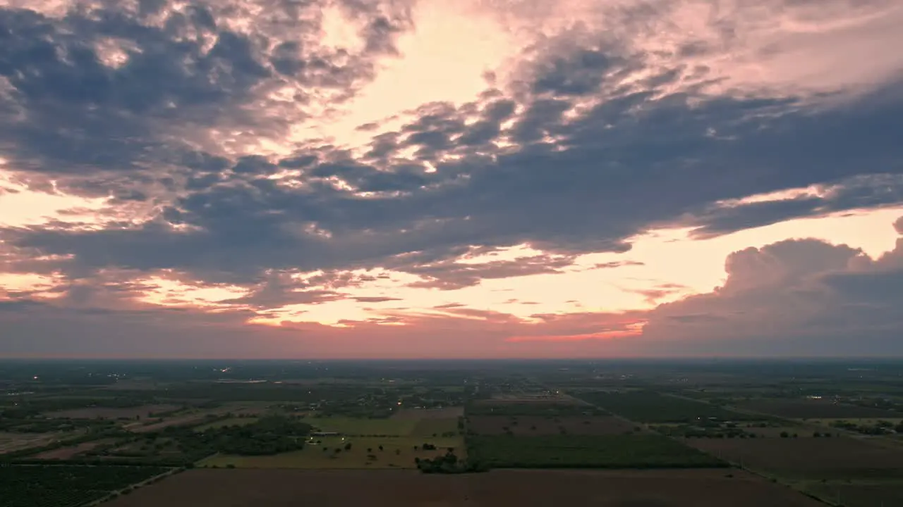 drone hyperlapse footage cloudy day sunset country side