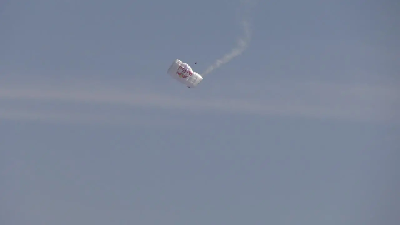 parachuter prepares to touch ground