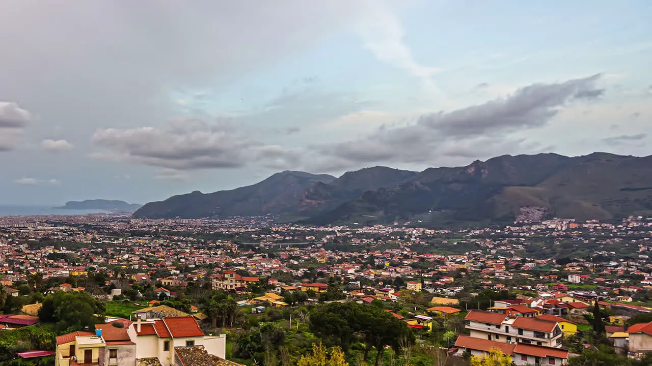 Sicilian landscape timelapse coastal city surrounded by mountains in Italy cloudy day