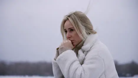 Worried woman standing outdoors