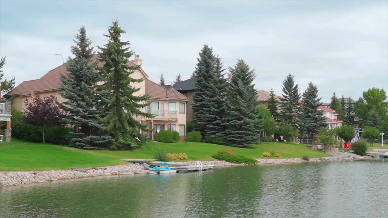 Private lake and beach in a private nice neighbourhood on a cloudy summer day