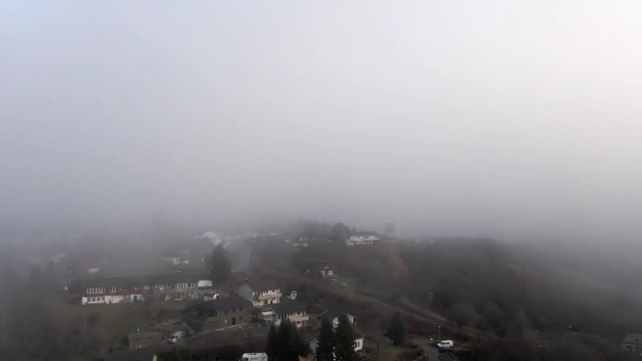 A neighbourhood from the sky in a misty day