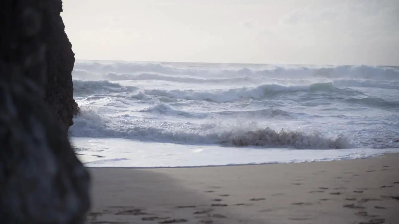 Violent Sea waves crashing at a beach of Praia da Adraga in Portugal