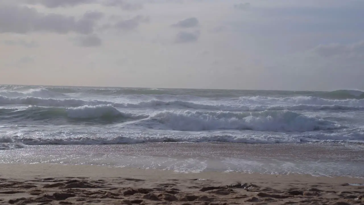 Sea waves crashing violently at a sea beach of Praia da Adraga in Portugal