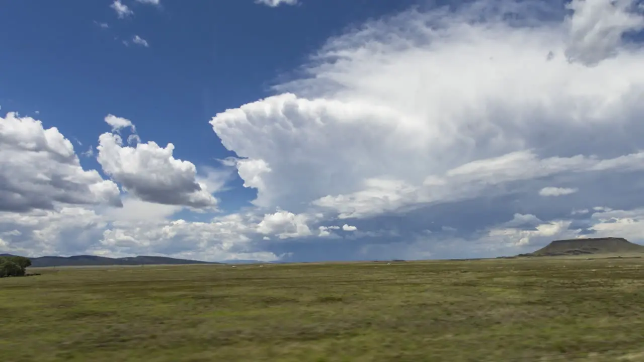 Hyperlapse of big storm clouds in New Mexico taken from a moving train