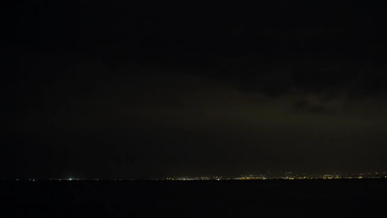 Lightnings in night sky over the city