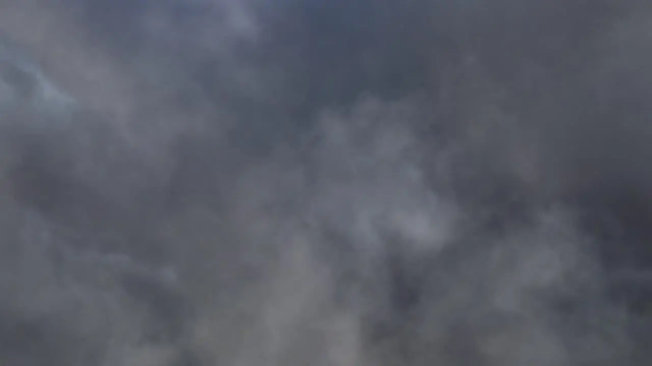 thunderstorm in gray clouds in dark sky