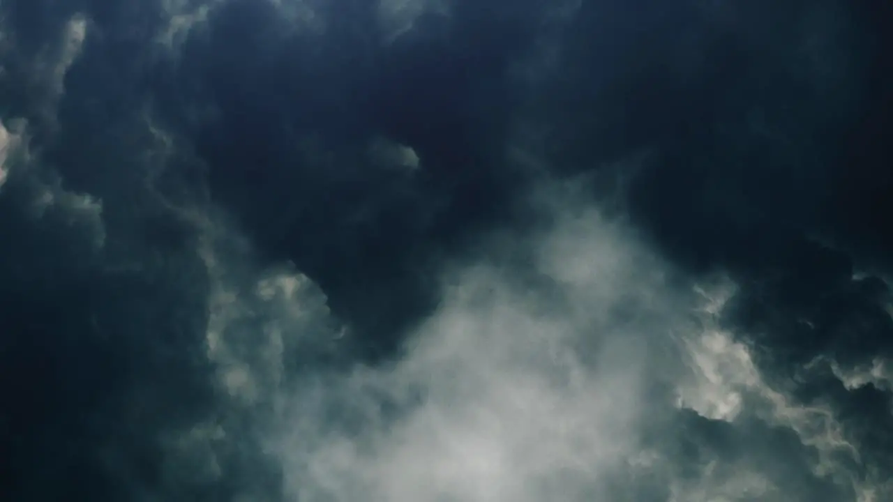 4k lightning flashes among thick cumulonimbus clouds in the sky thunderstorm