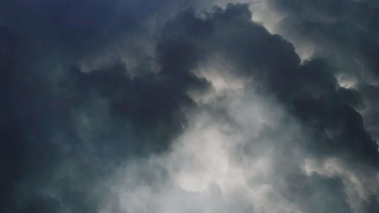 4k lightning flash over dark sky and clouds thunderstorm