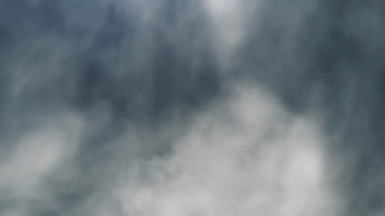 4k thunderstorm wisps of white clouds moving with lightning flashes