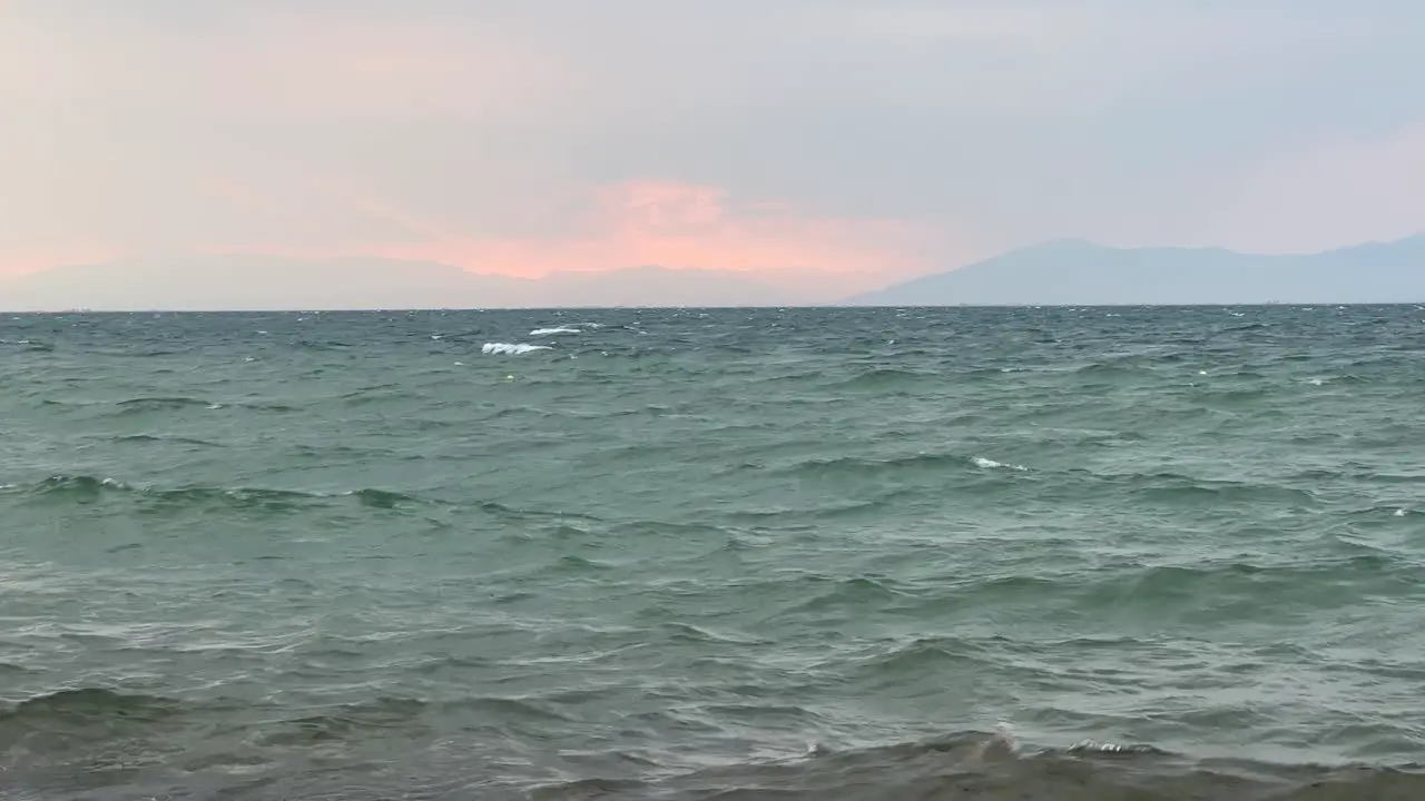 Windy sea and waves with mountain view pastel background