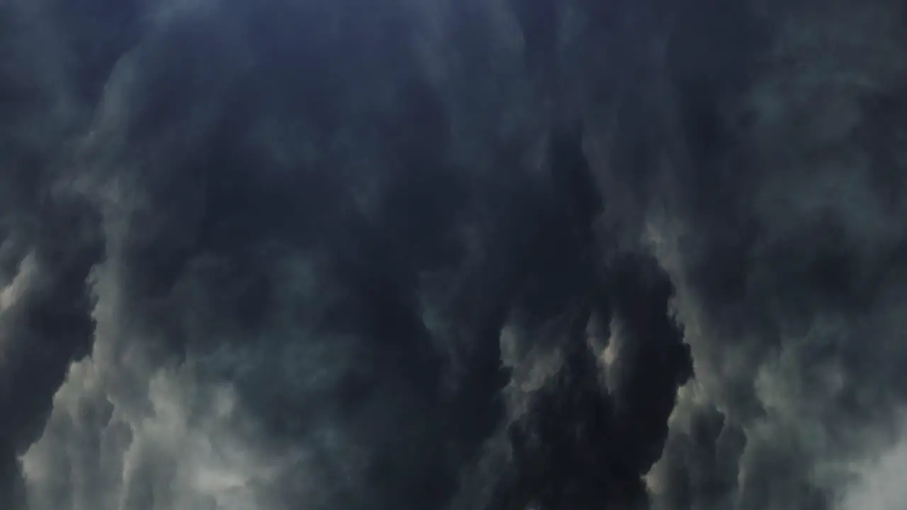 thunderstorm swirls inside dark clouds in the sky