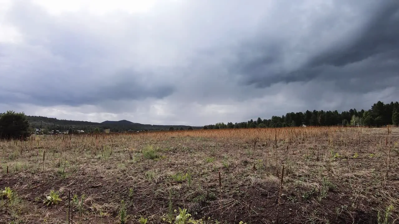 Time-lapse storm clouds pass over open in field in Northern Arizona Williams Arizona