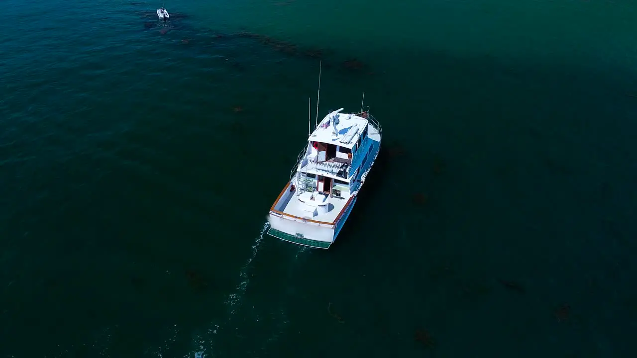 a Boat sitting in shallow water In San Diego Bay