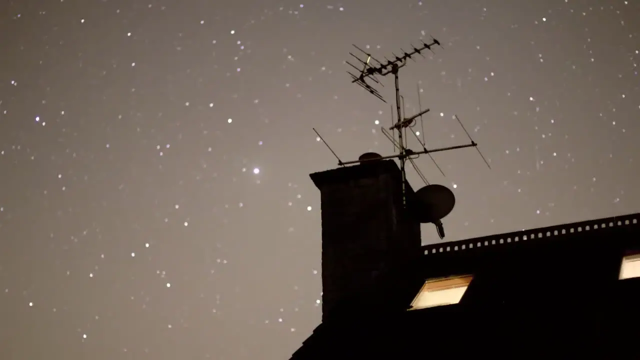 Night Sky Time Lapse with Moving Stars House in Foreground