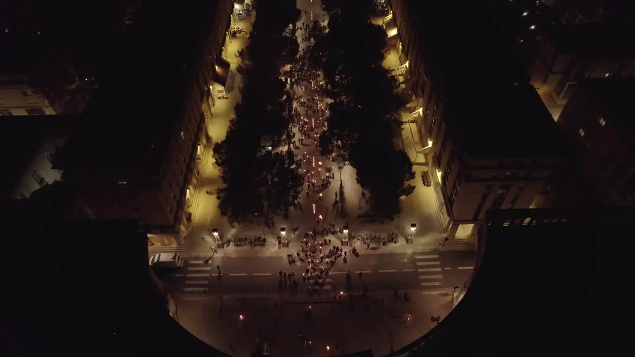 Fire lit torches on a parade during the night in Montpellier France