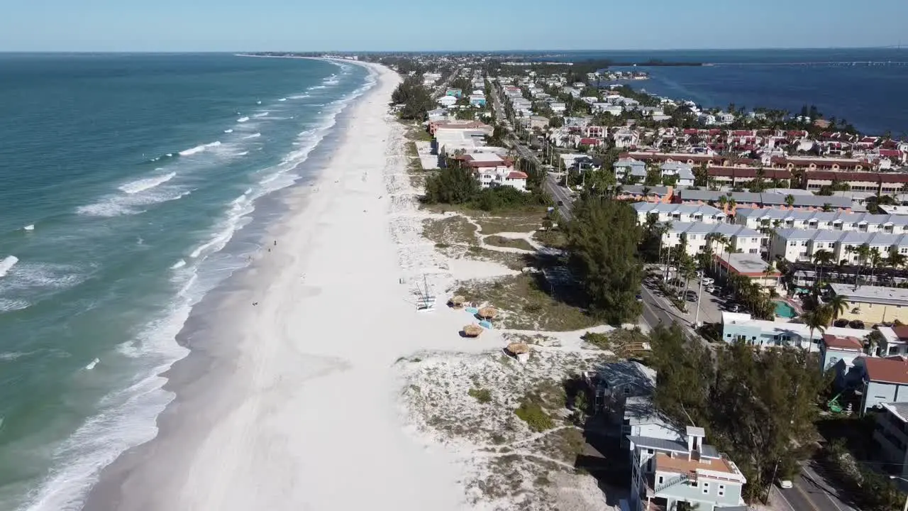 Drone descending and landing on a Florida beach